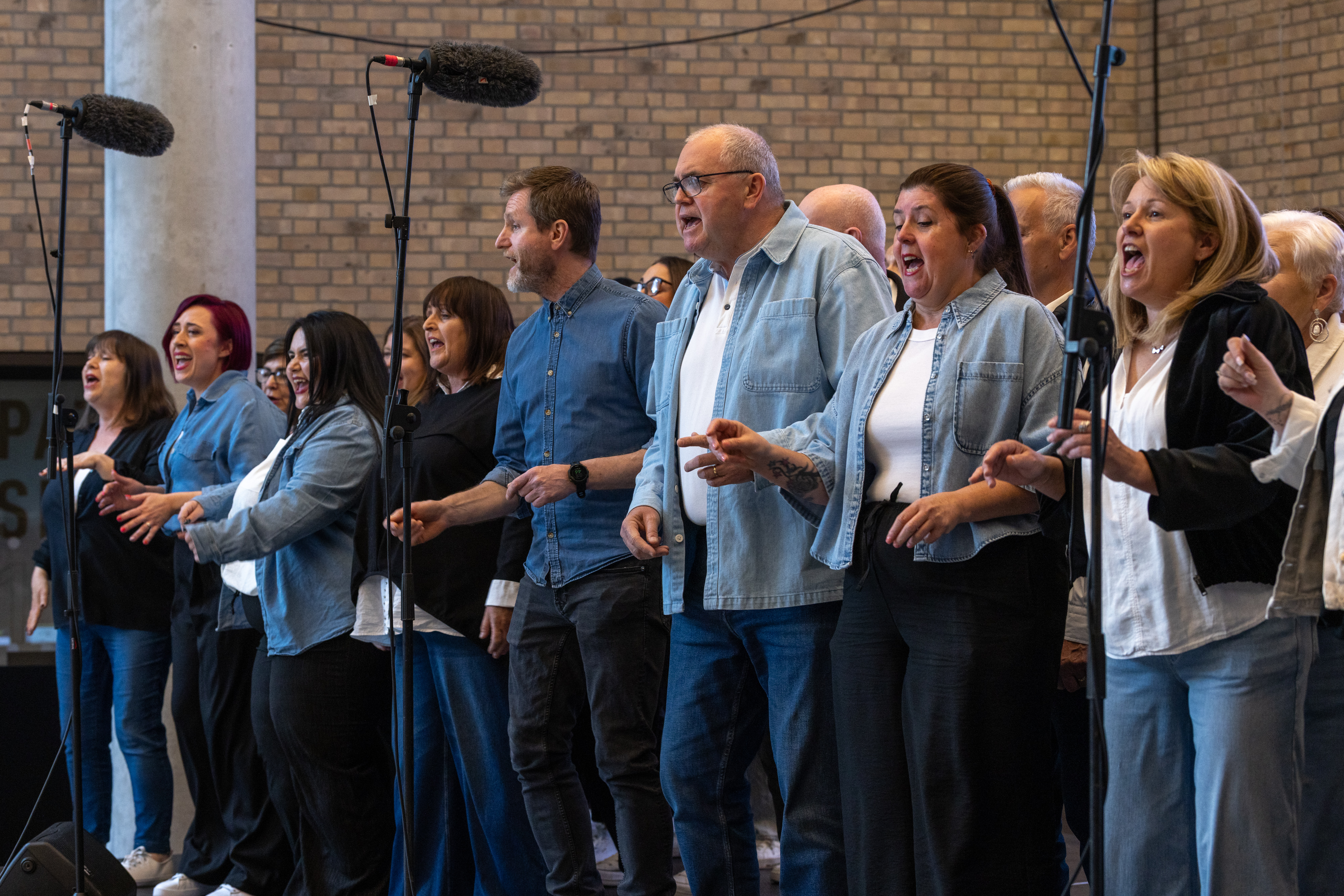 Group on stage singing.